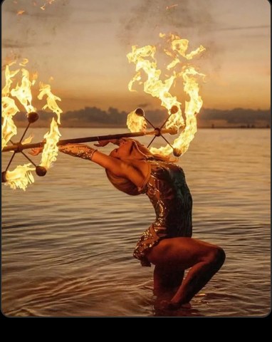 Fire dancer at sunset