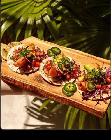 Fresh tacos on a wooden board